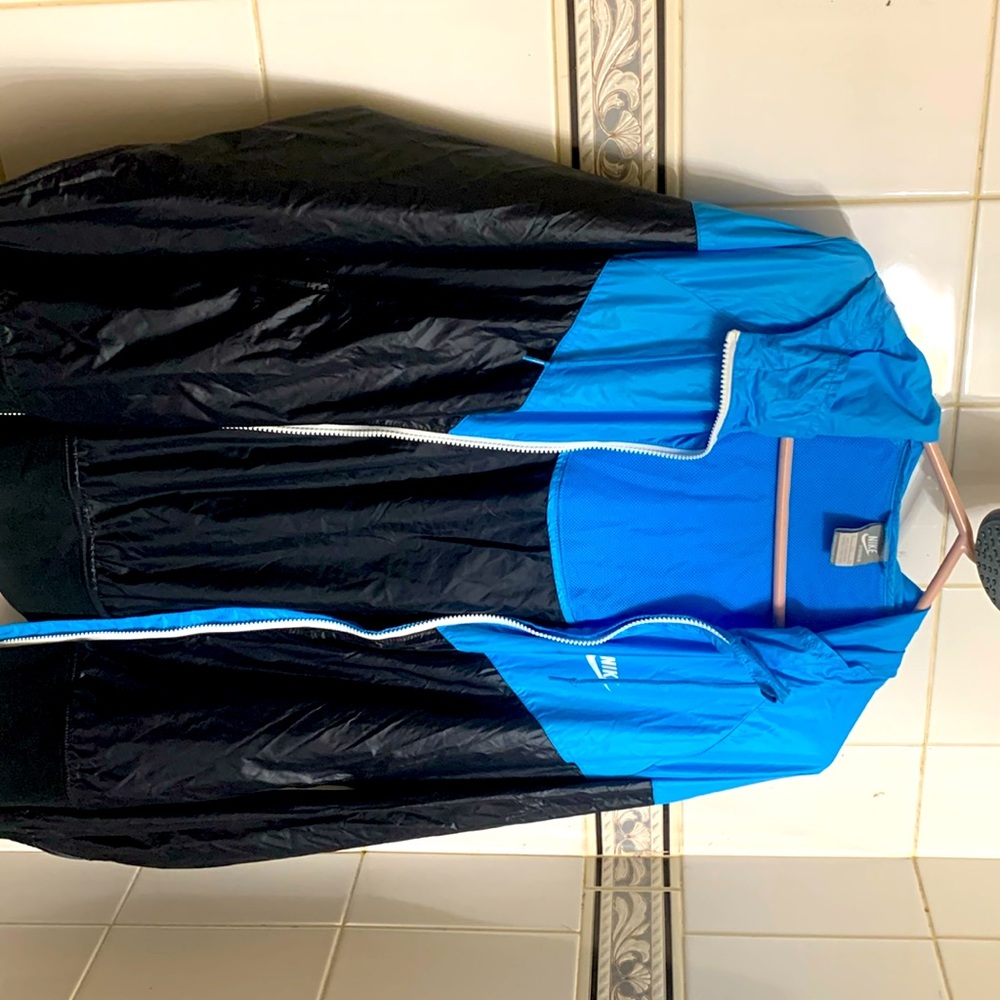 This design is found in Hong Kong. Nike sports windbreaker. Lightly worn